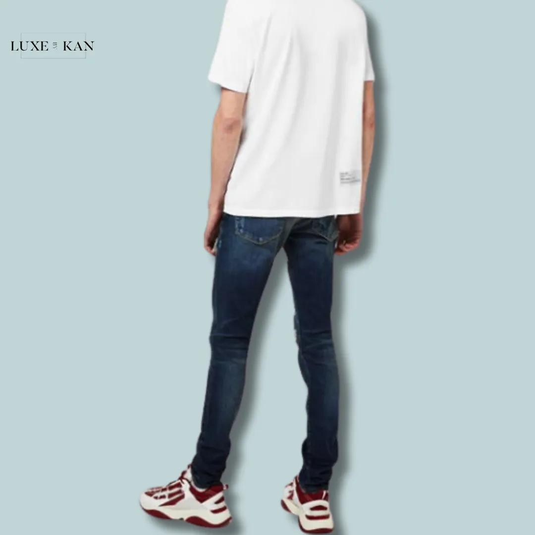 AMIRI
MX-1 DISTRESSED JEANS
