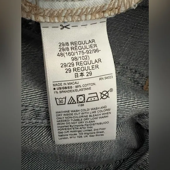 Gap Mid Rise Girlfriend Jeans distressed by manufacturer rips raw hem 29 NWT
